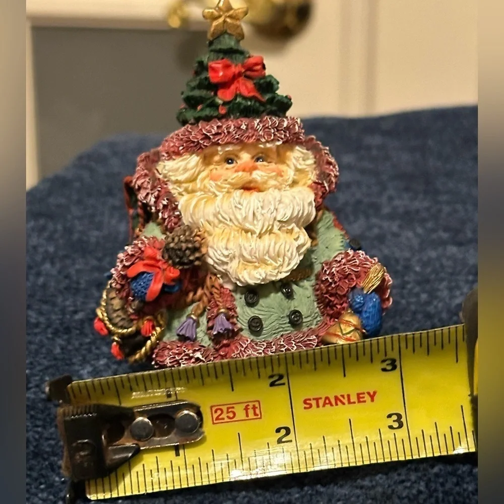 So adorable - mini Santa dressed for traveling! Wears a Christmas tree hat!